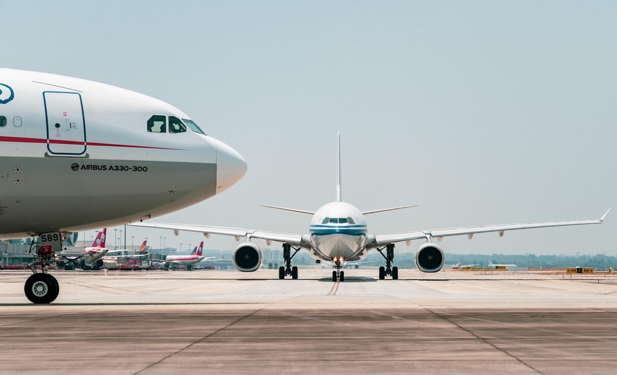 Airplanes waiting on a runway Airplanes waiting on a runway